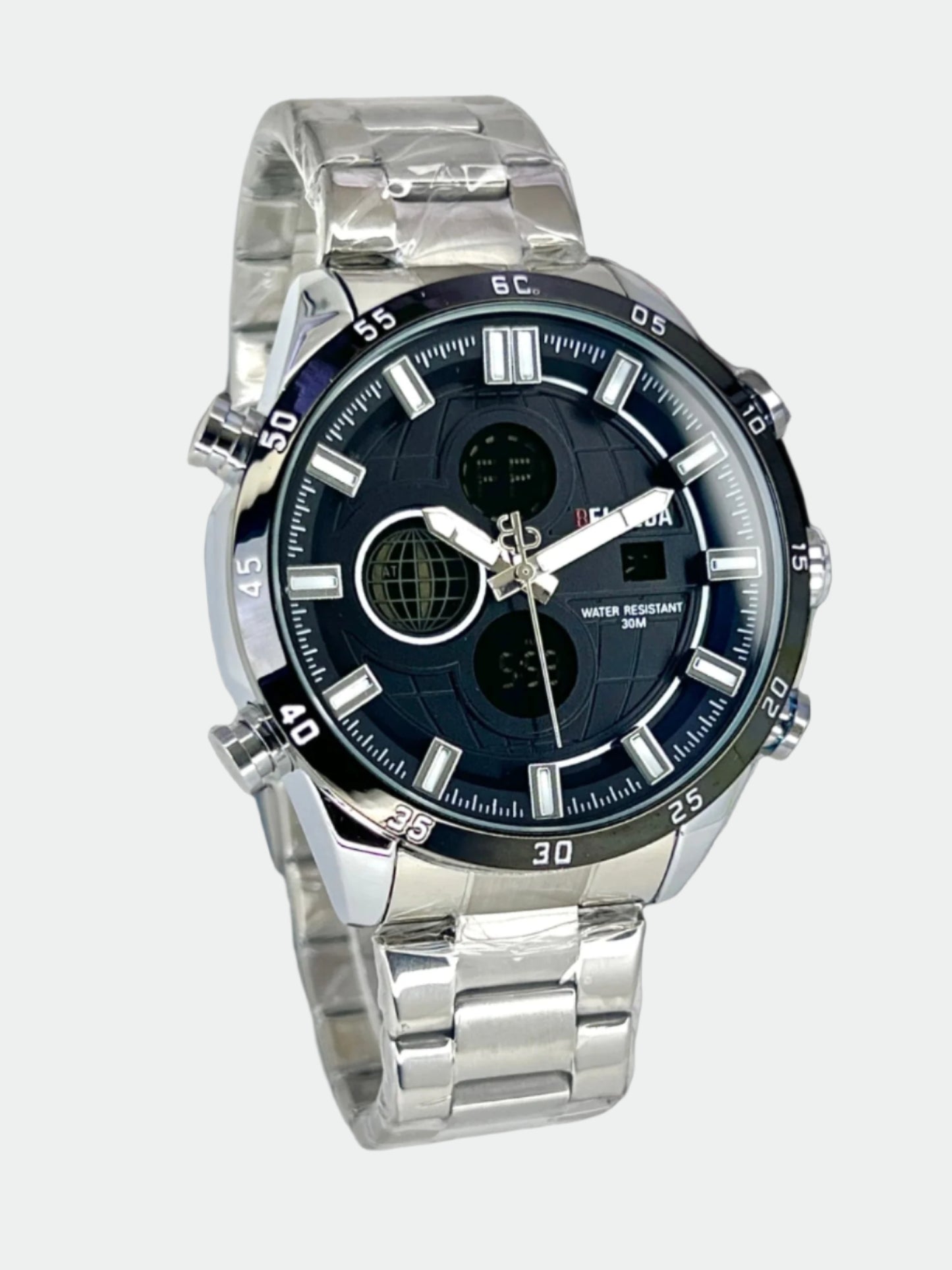 Silver watch with a black face on a reflective surface, Belleda branding visible.